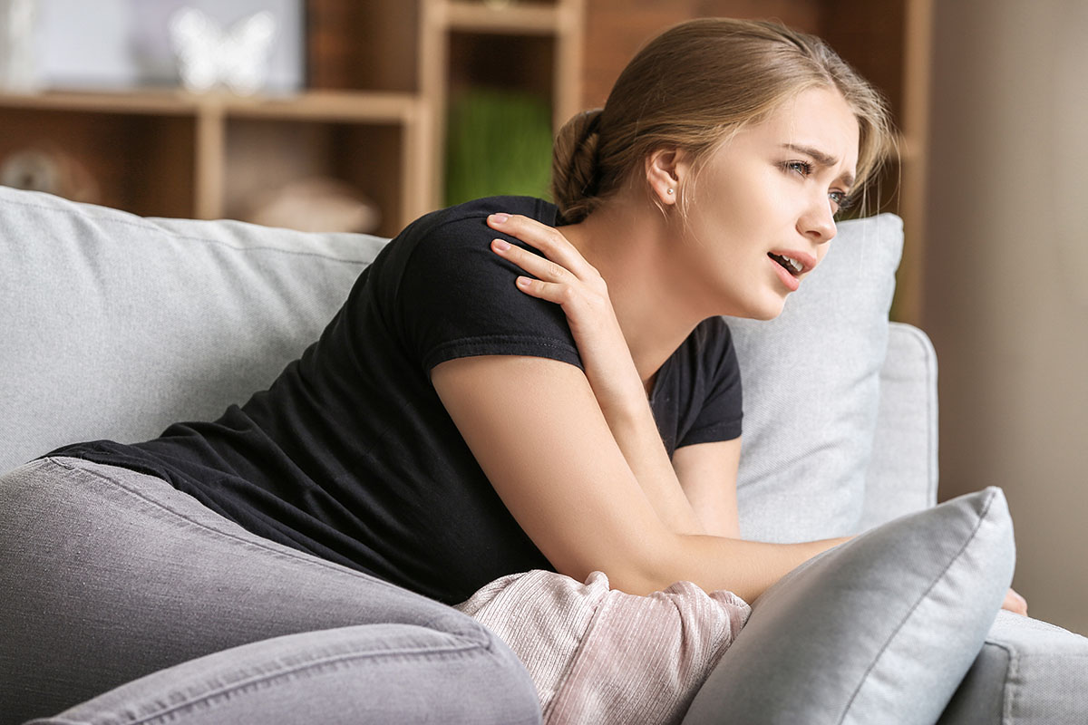 a woman showing signs of a panic attack