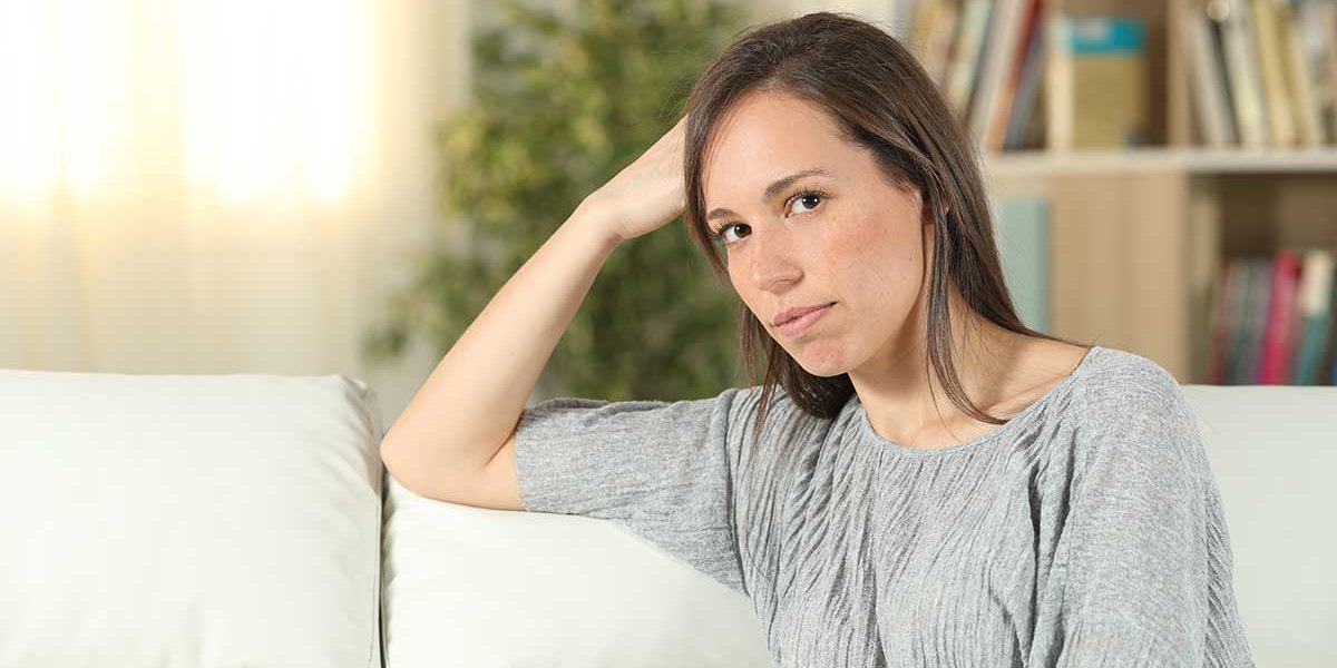 woman on couch learning about Mental Illness Awareness Week
