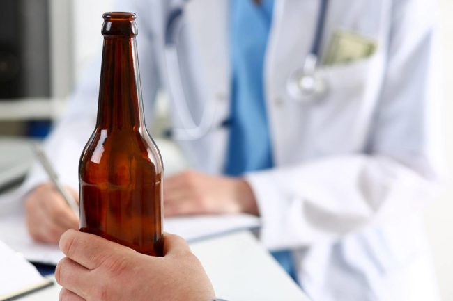 an alcohol bottle that leads to the need for medical detox