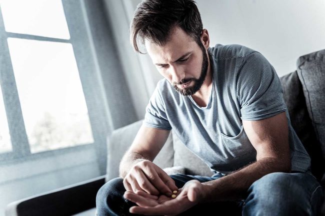 man struggles with what to do about drug cravings