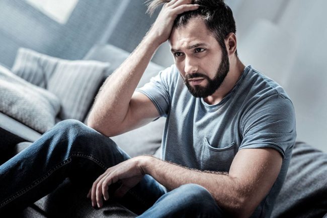 Man considers the link between depression and addiction