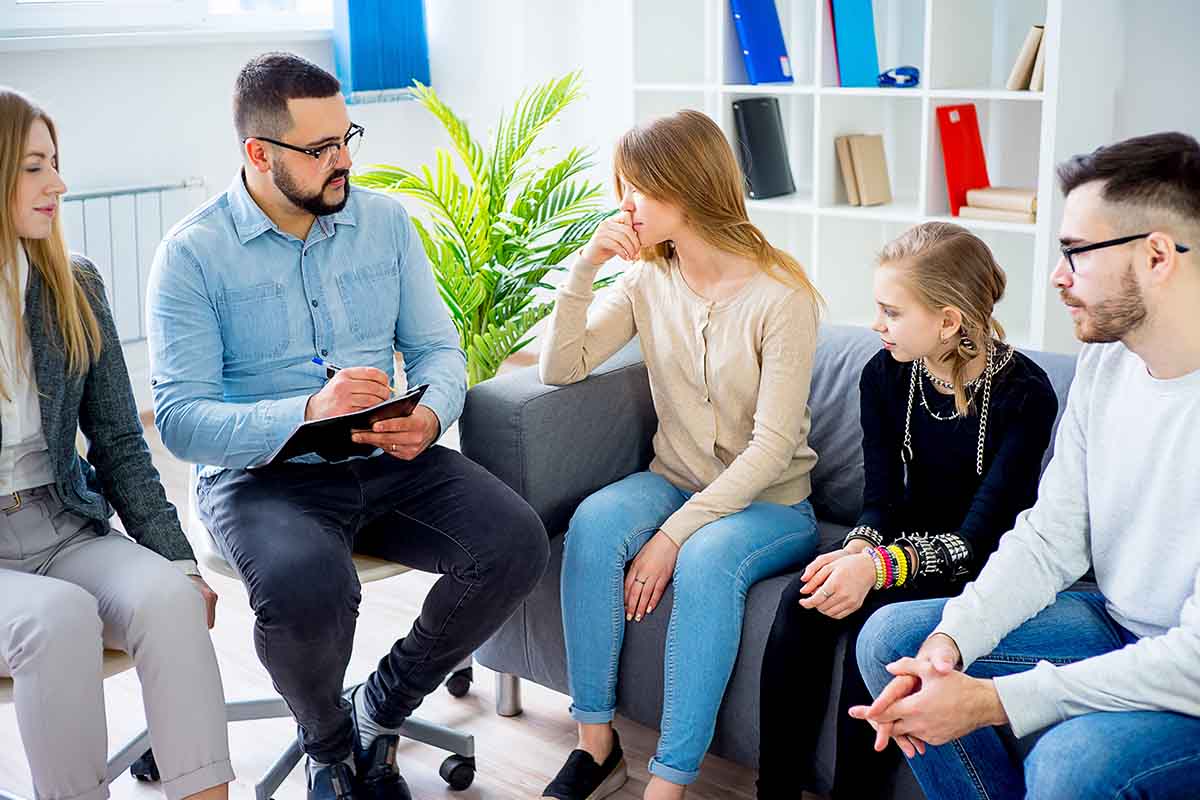 family participates in family therapy
