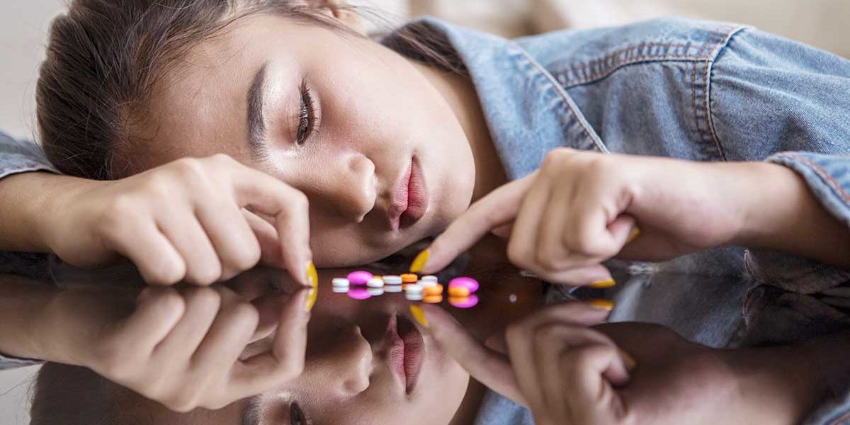 4-The-Differences-Between-Dependence,-Abuse,-and-Addiction-of-Prescription-Drugs- Woman considers the difference between dependence abuse and addiction