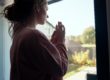 woman looking out her window thinking about tips for controlling a meth relapse