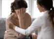 a woman talking to her doctor about what is a psychological disorder