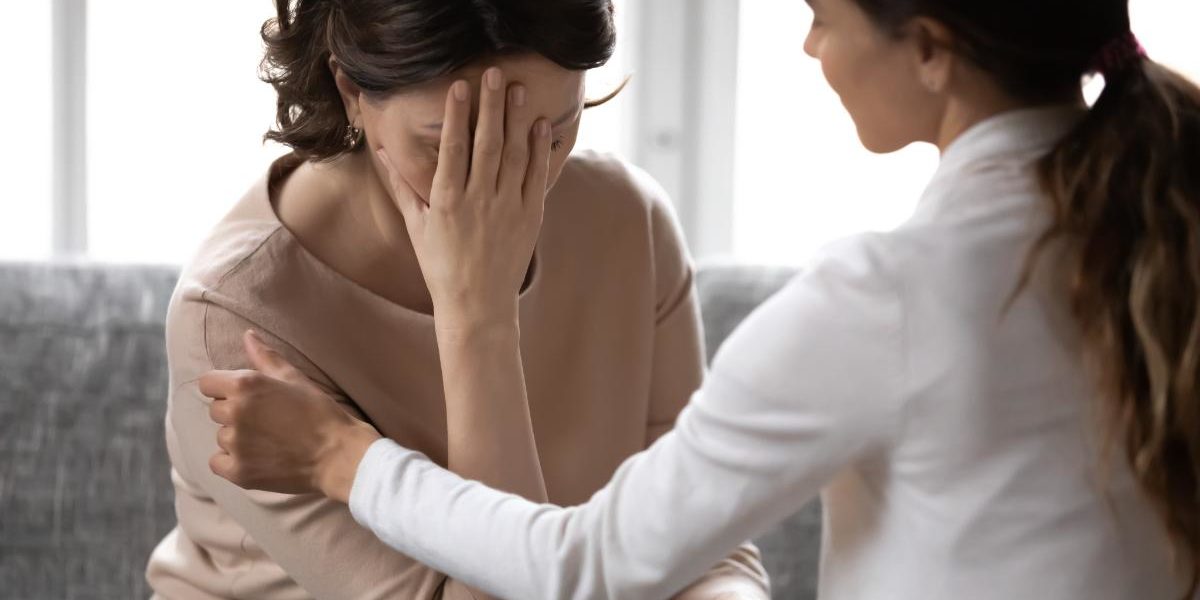 a woman talking to her doctor about what is a psychological disorder