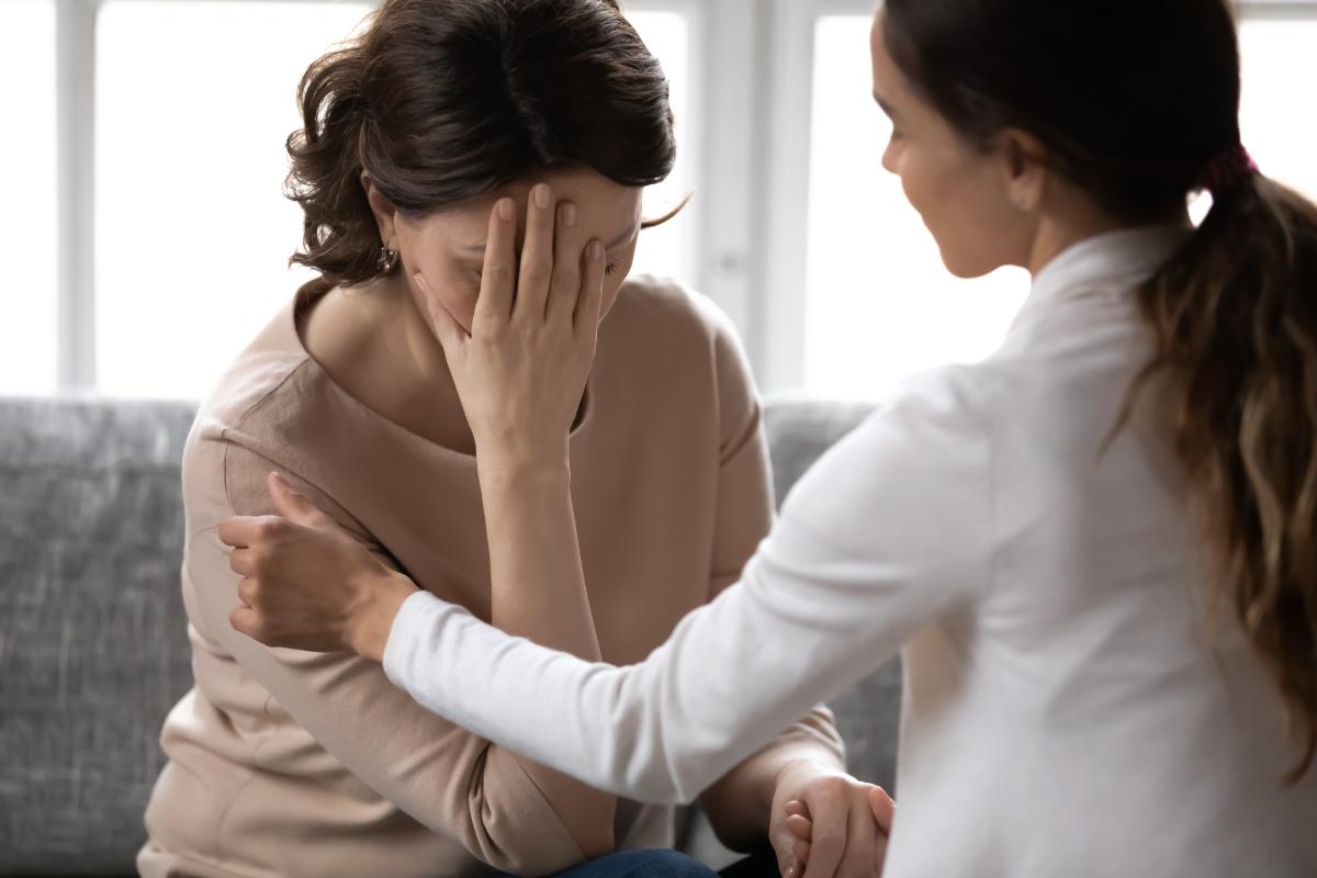 a woman talking to her doctor about what is a psychological disorder